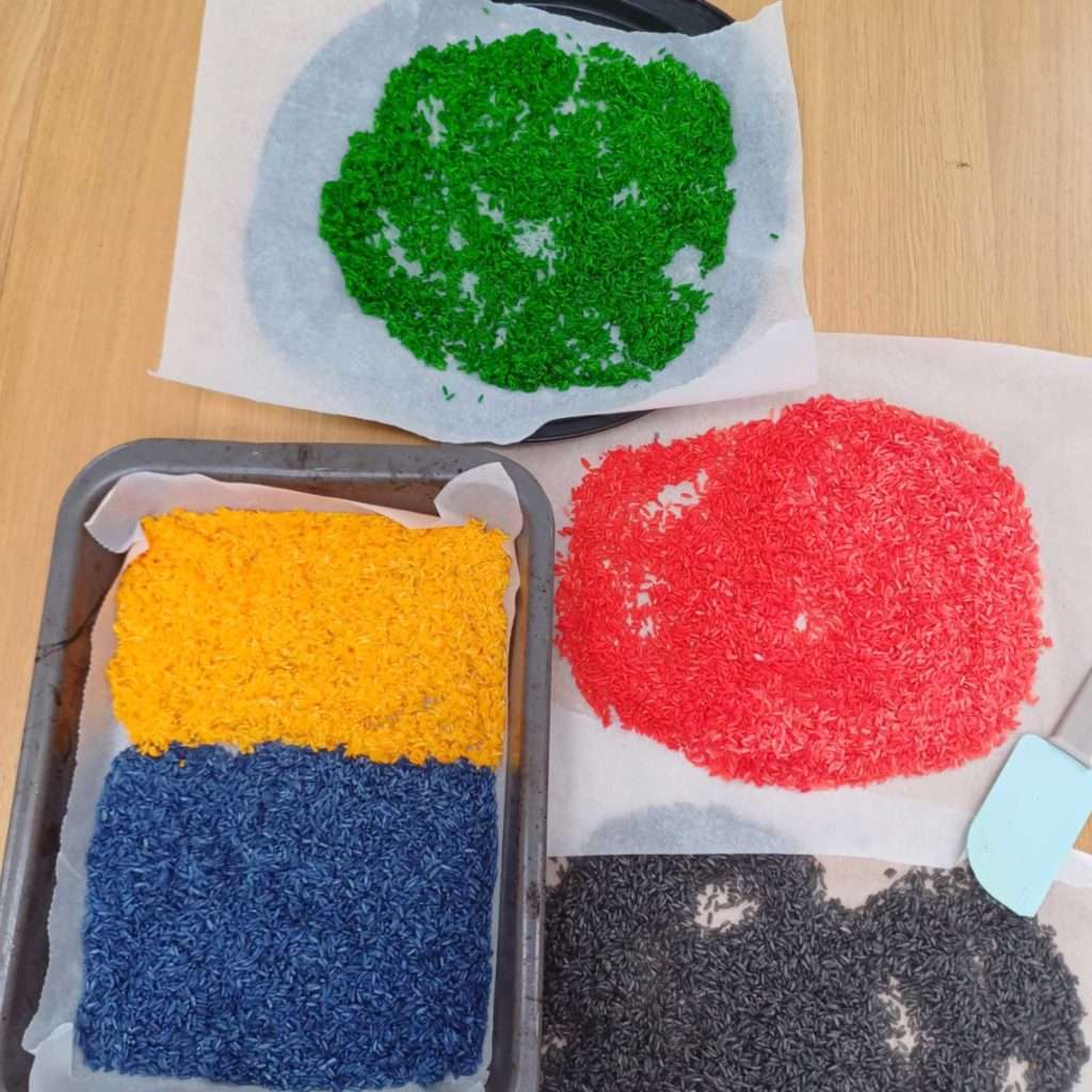 colored rice on the baking sheeets